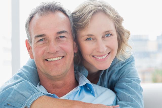 couple smiling with dental crowns in simi valley ca